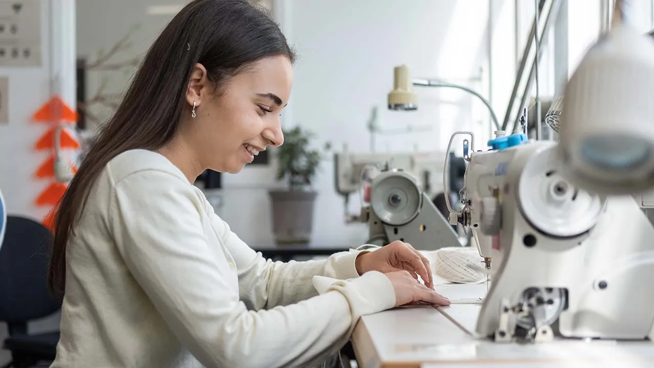 A student using a sewing machine