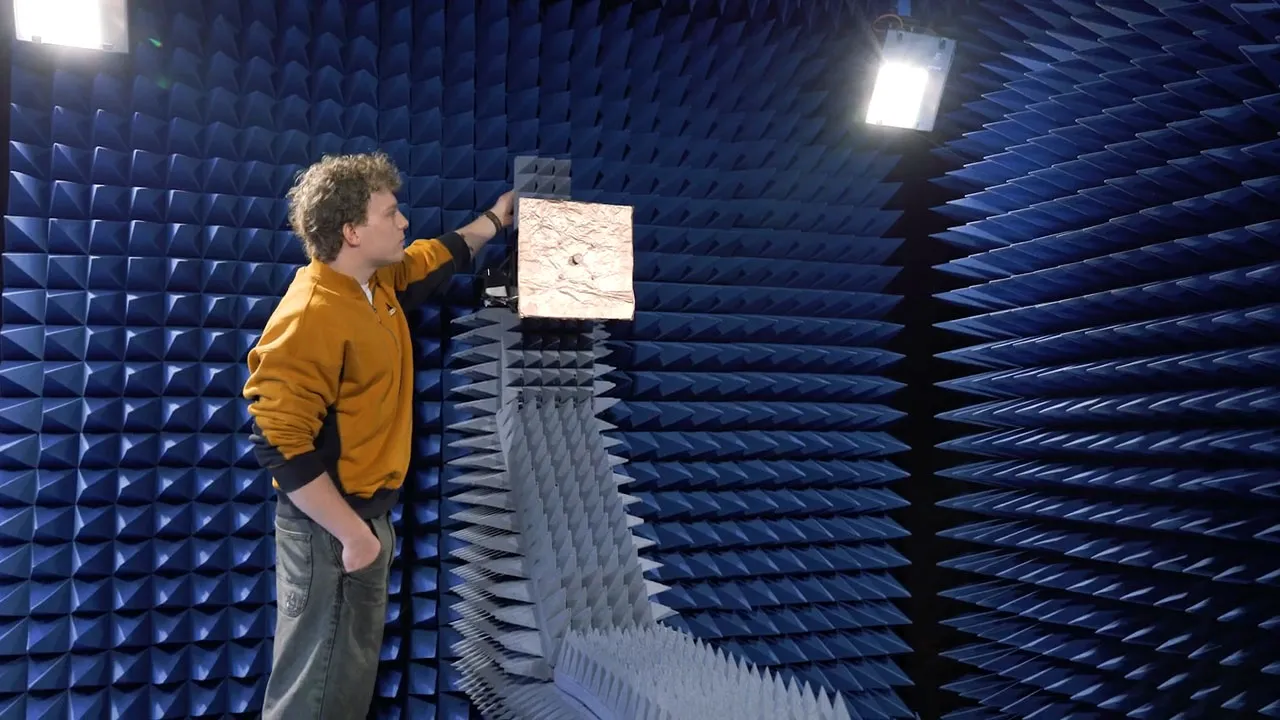A student carrying out an experiment in the anechoic chamber