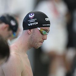 Dan Wiffen side profile shot wearing a swimming cap