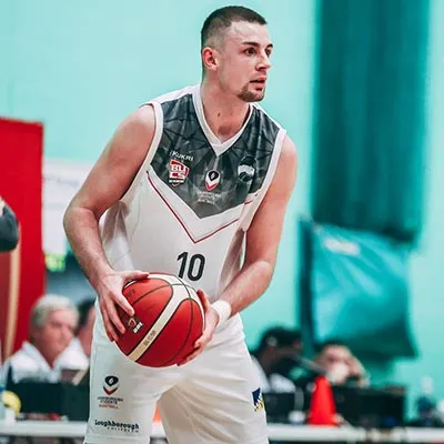 Evan Walshe holding a basketball