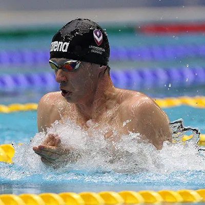 Greg Butler swimming in a pool