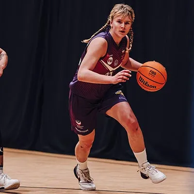 Katie Januszewska holding a basketball