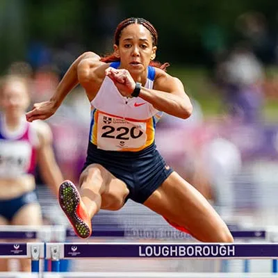 Katarina Johnson-Thompson jumping over a hurdle