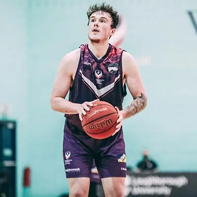 Kyle Jiminez holding a basketball