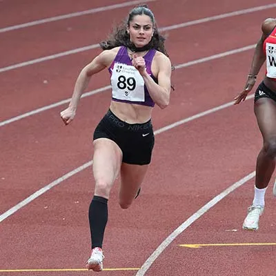 Poppy Malik running in a race