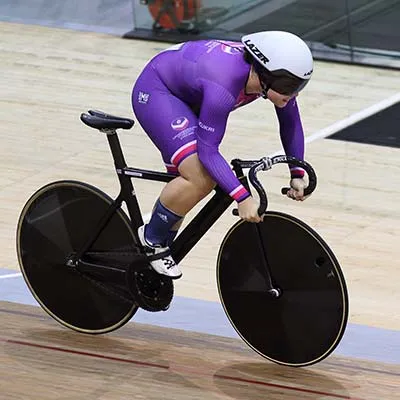 Sophie Capewell cycling on an indoor track