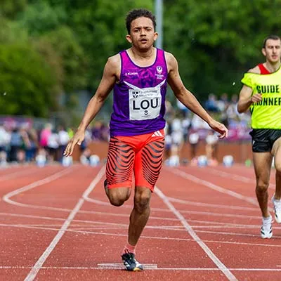 Thomas Young running on a track during a race
