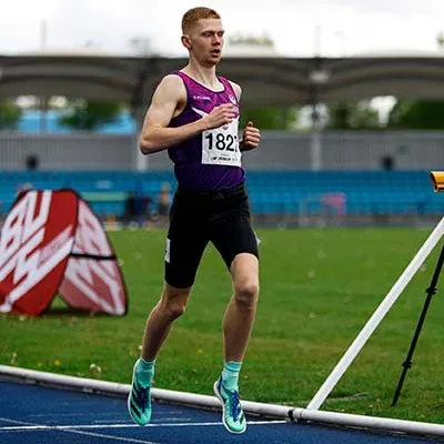 Ben Pattison running on a track