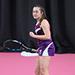 Nadia Rawson on a pink tennis court holding a racket