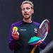 Dave Boddy holding a tennis ball and racket