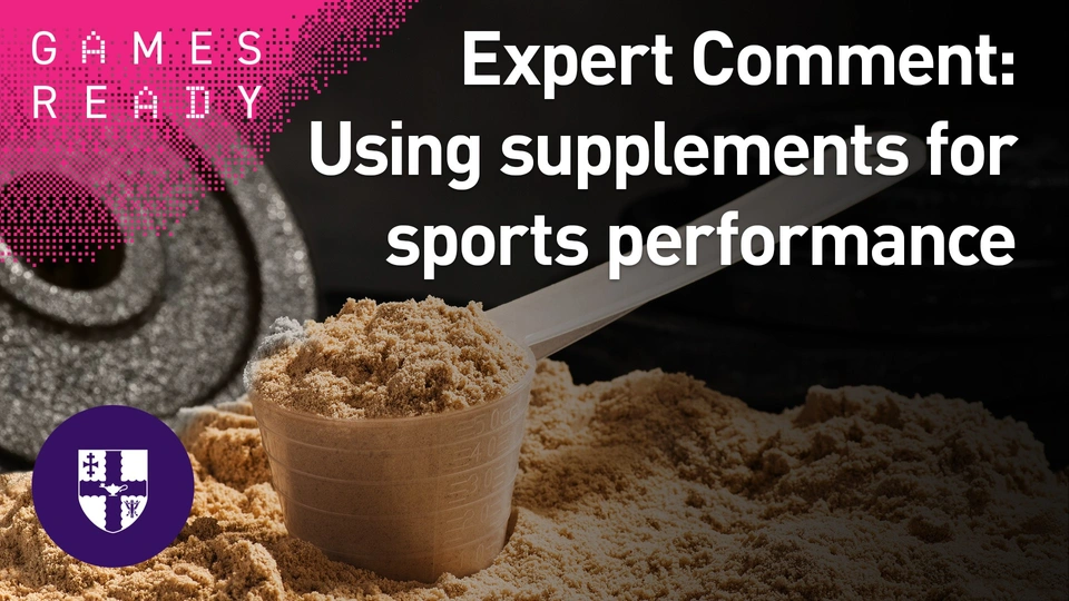 glass of protein powder and some weights