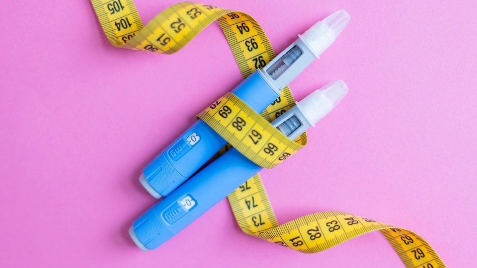 weight loss injections with tape measure wrapped around