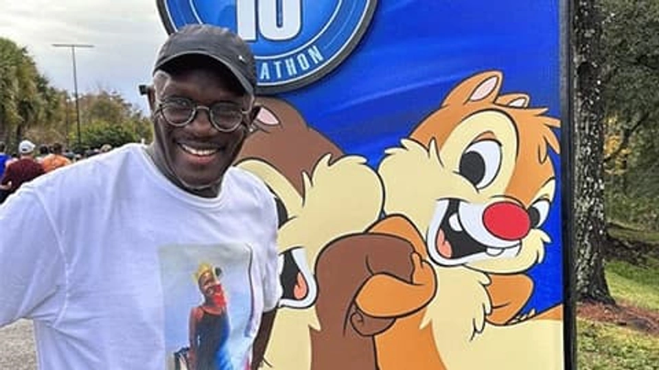 Edward in his running gear smiling at the camera.