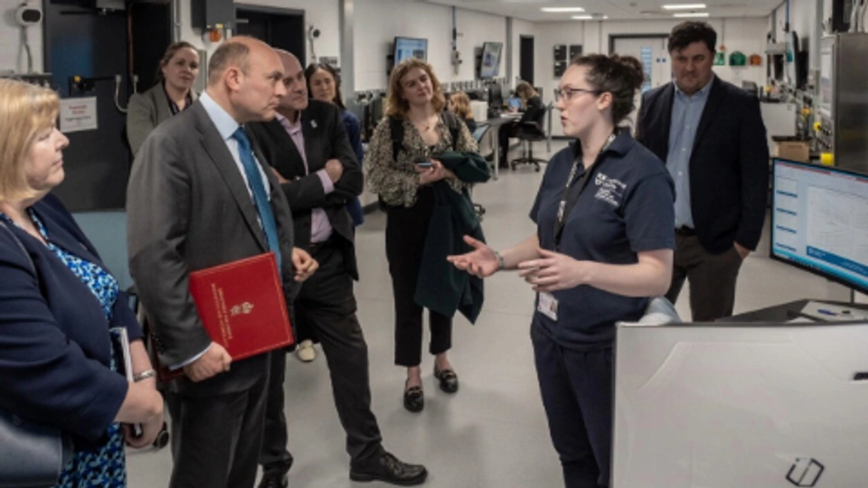 Minister Andrew Griffith MP talking to NCCAT staff member