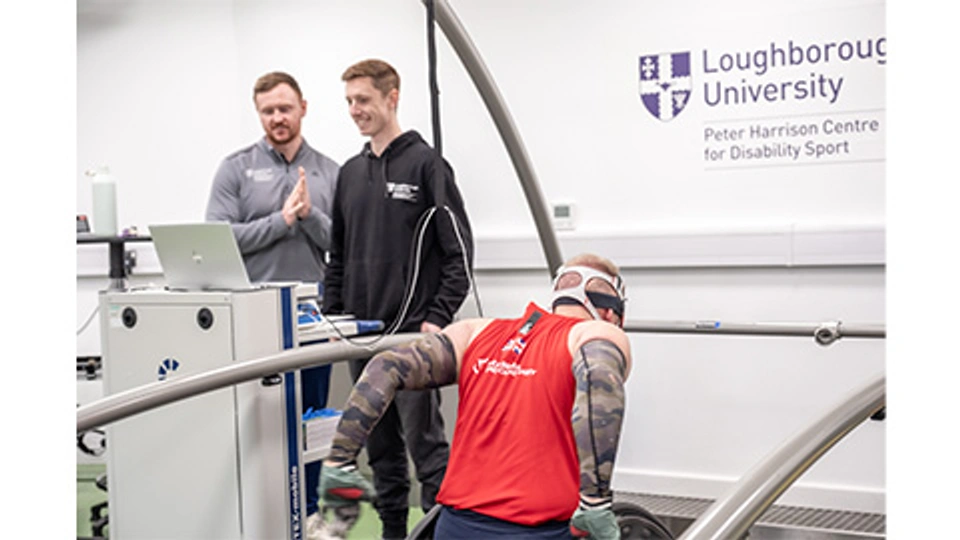 PhD Student and PHC member of staff with a GB wheelchair rugby player on the treadmill in the PHC lab