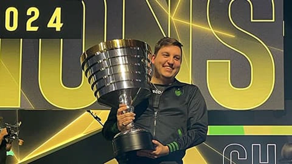 Grant Rousseau lifting trophy