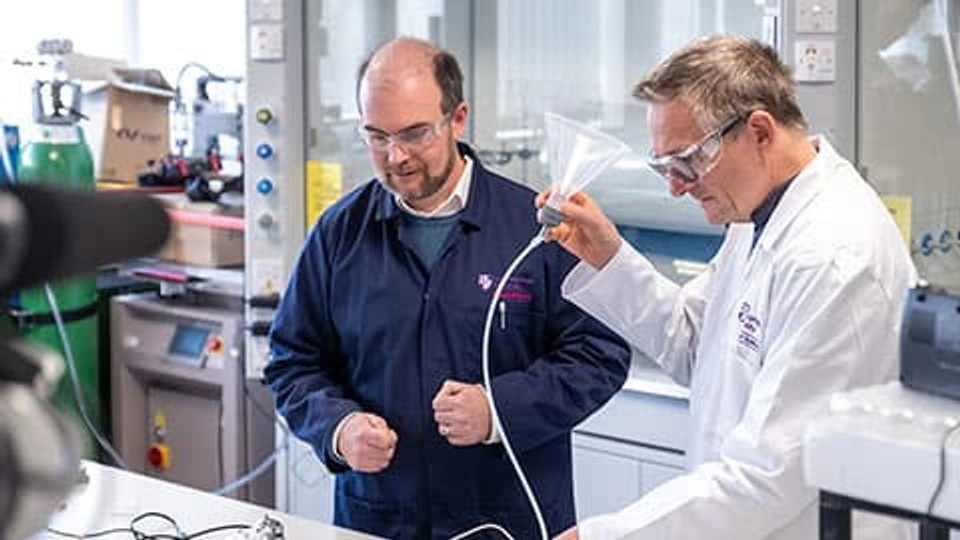 Dr Jim Reynolds and late Michael Mosley in lab coats