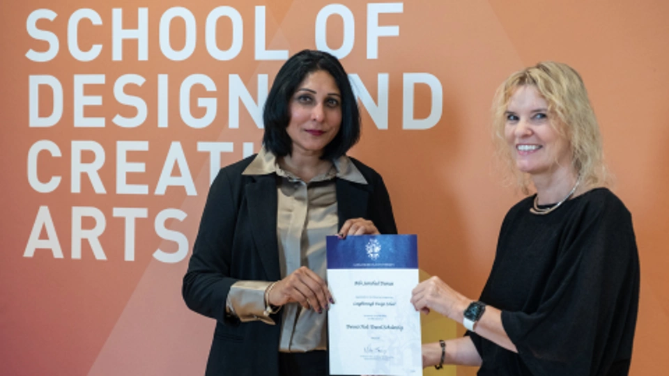 Bibi, Dennis Holt Prize Winner stood with certificate