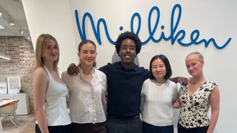 Milliken Design Competition Winners stood together smiling for a photograph