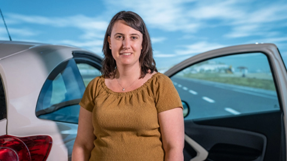 Ashleigh Filtness stood next to vehicle