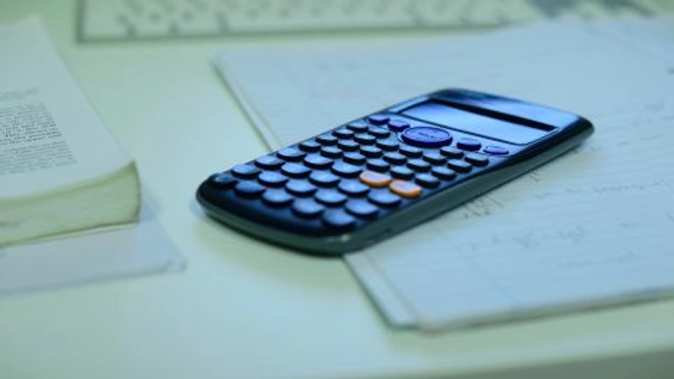 Photograph of calculator on book 