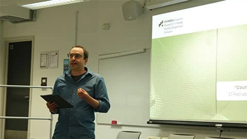 Dr Yuval Katz speaking at the symposium