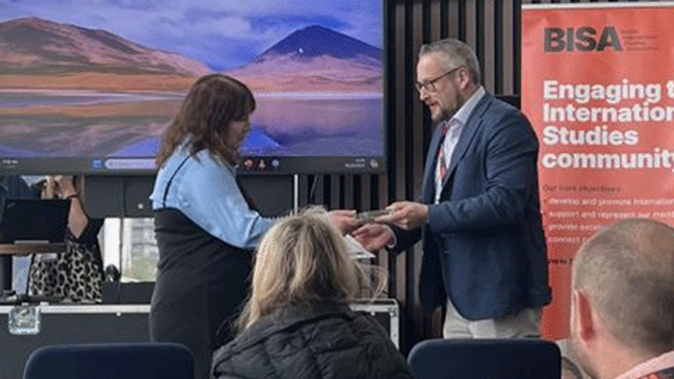 Caroline is presented with her award