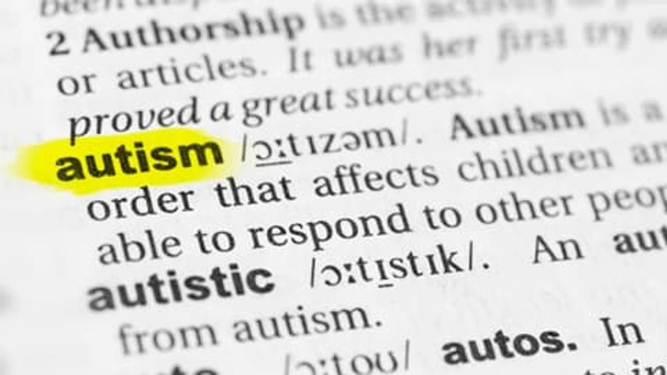 words from a dictionary with the word 'autism' highlighted in yellow
