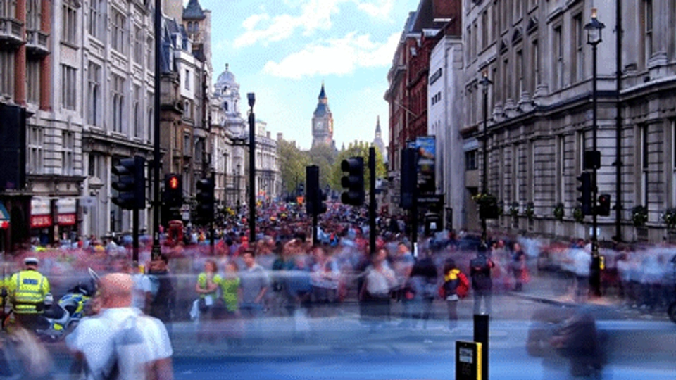 A busy street in London with Big Ben in the background