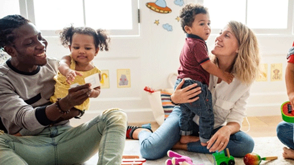 two parents with toddler children