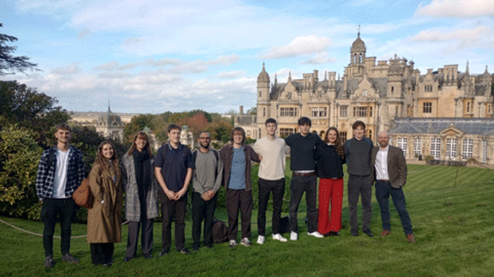 A group of students standing in front of Harlaxton Manor