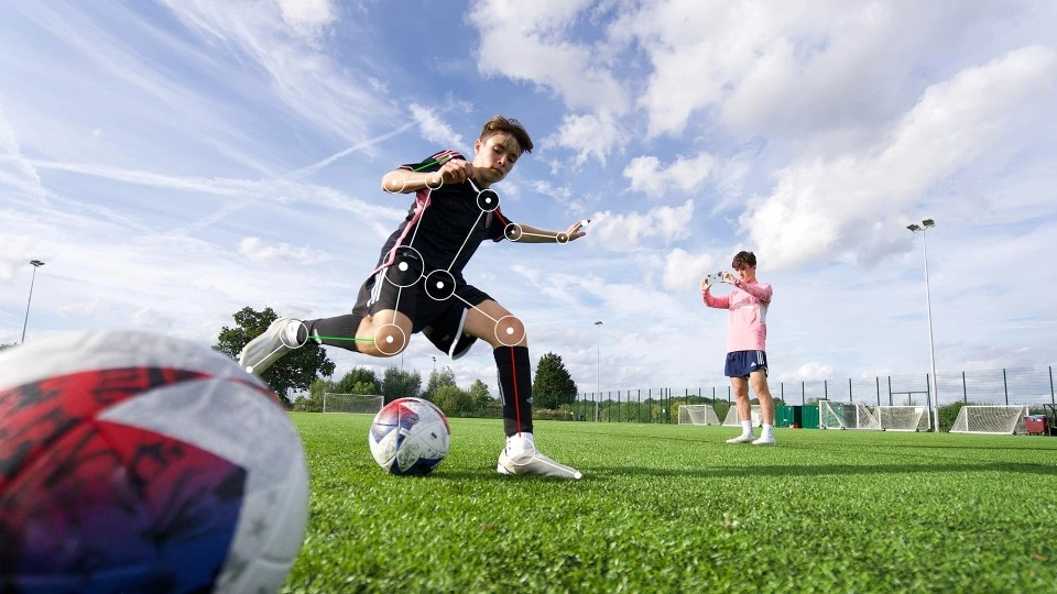 Man kicking football with vector lines on him. Image from ai.io