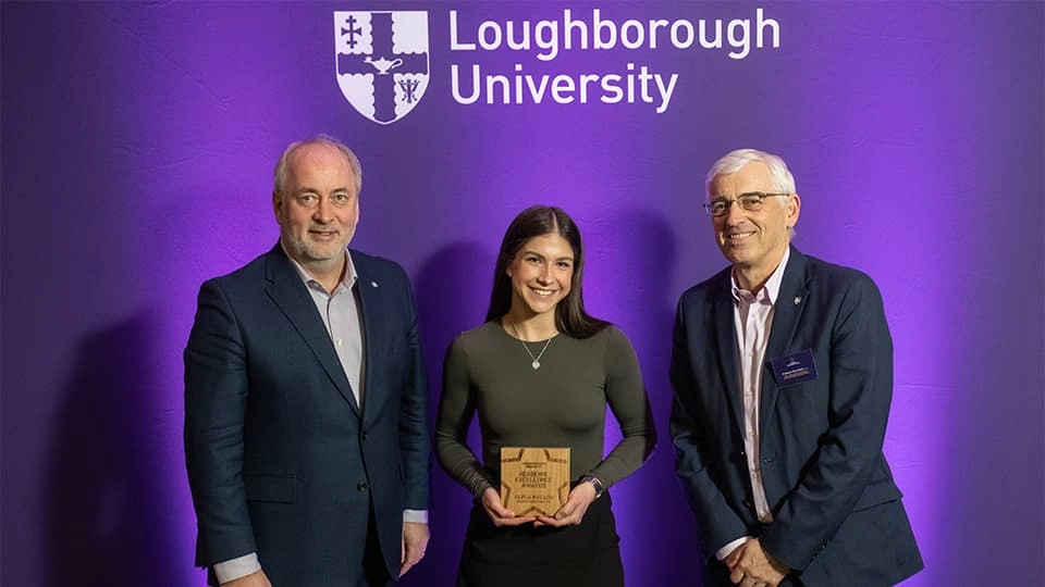 Dean of AACME (Chris Reilly) and Pro Vice Chancellor (Nick Jennings) with AACME student who is holding an award
