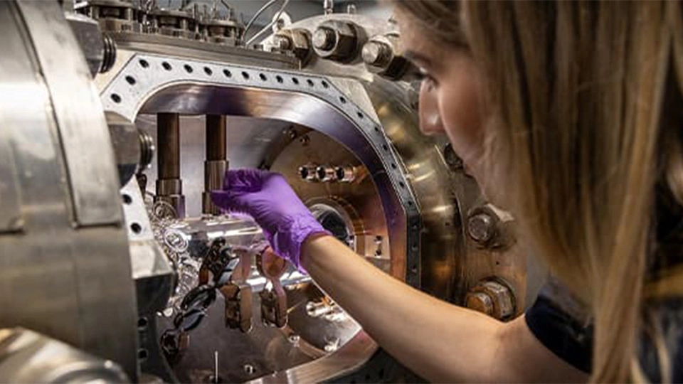 Research student working on hydrogen combustion engine