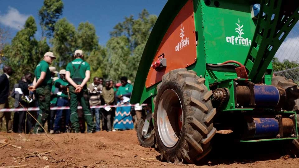 Aftrak engineering system in Malawi with two members of Aftrak team