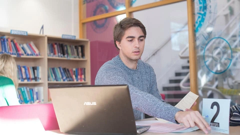 a student studying on the computer