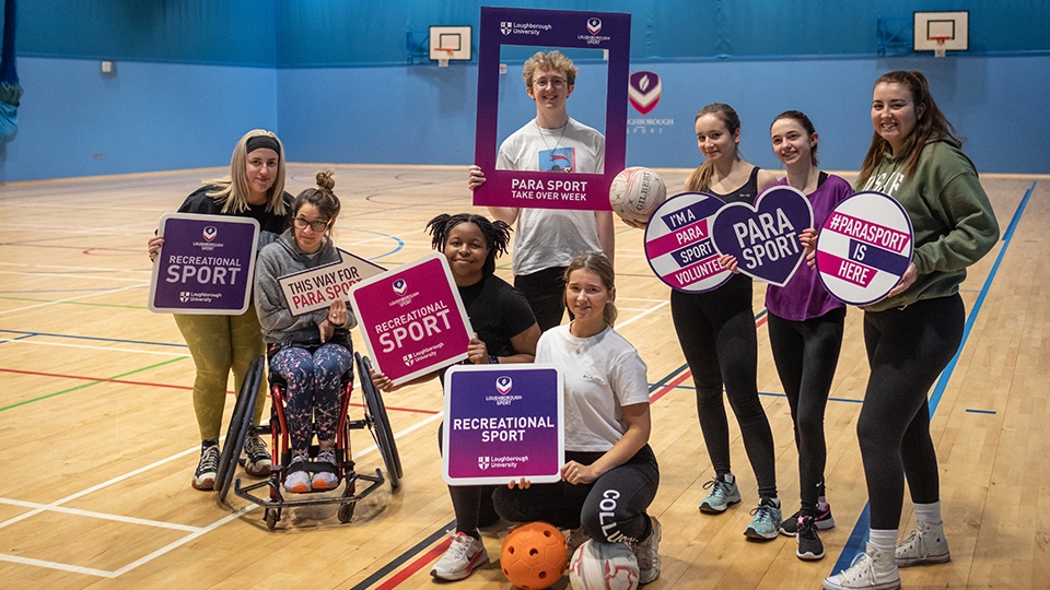 A mixture of students holding para sport signs