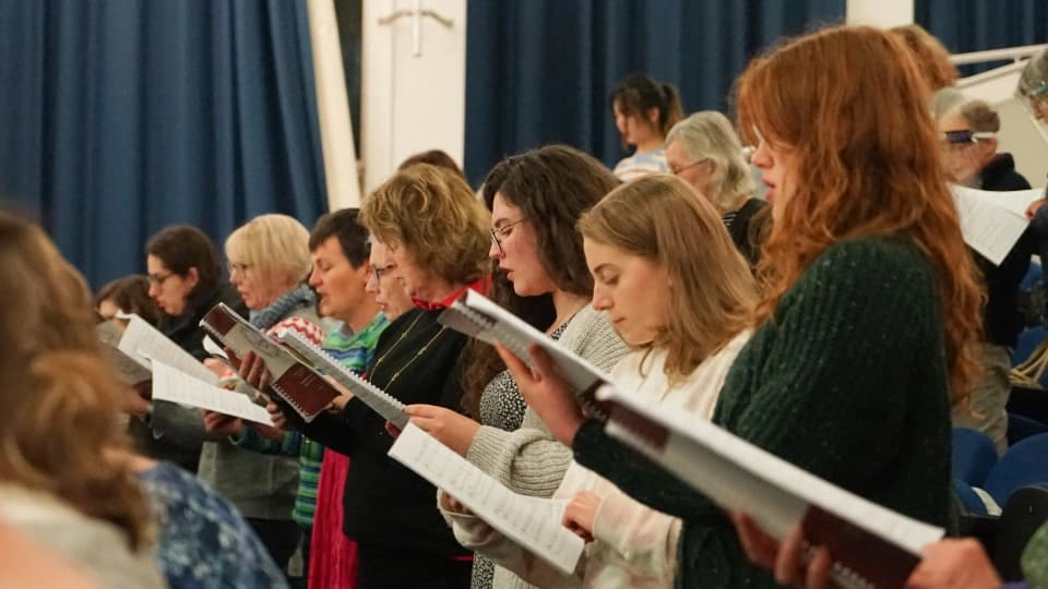 Singers with sheet music at the University Choir taster session