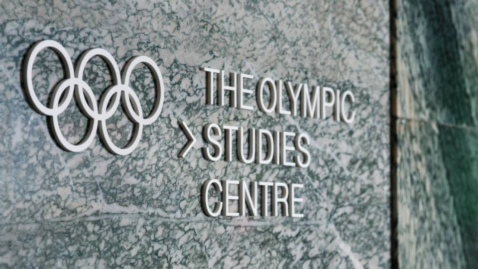 the logo of an olympic studies centre