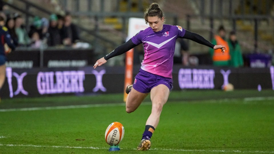 helena rowland kicking a rugby ball