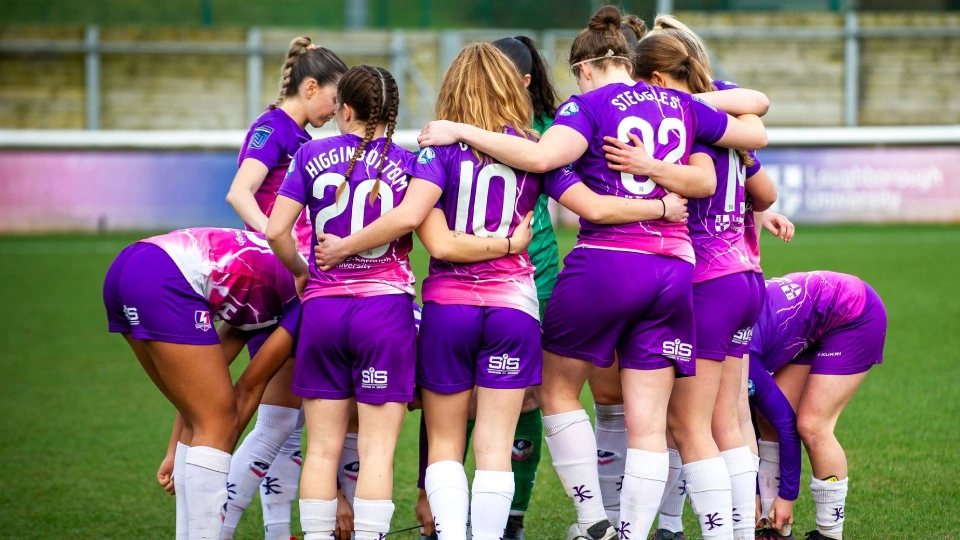football players in a huddle