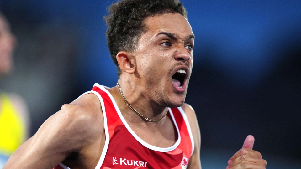 tom young celebrates winning gold