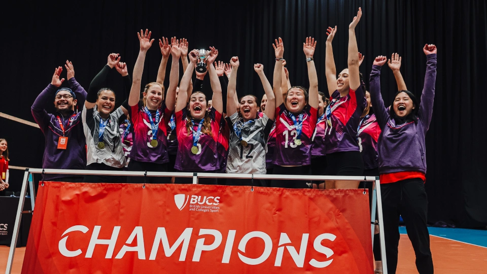 volleyball team lift the championship trophy