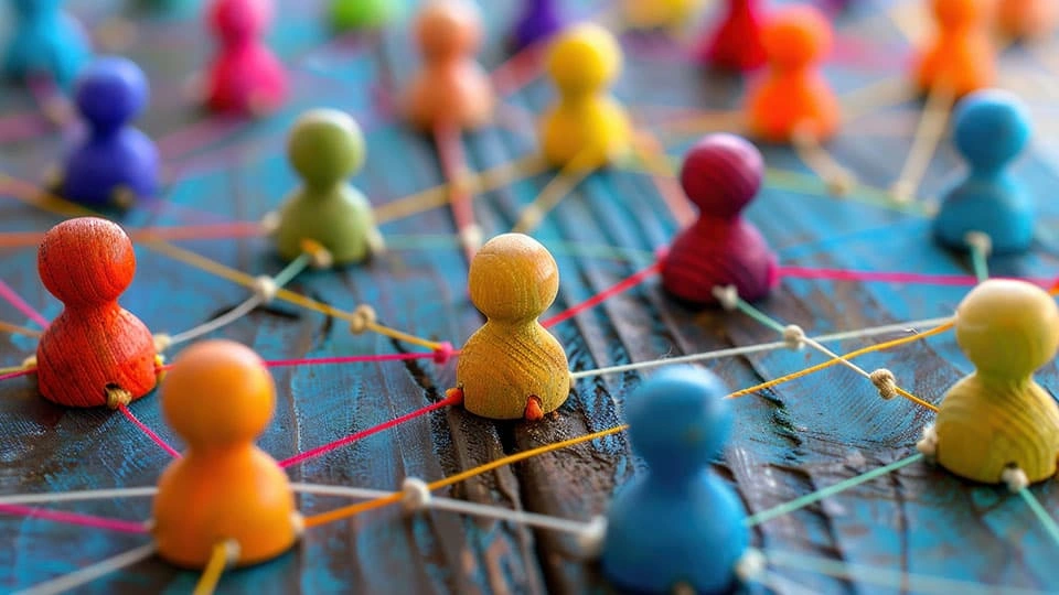 Colourful pins connected by a web of thread