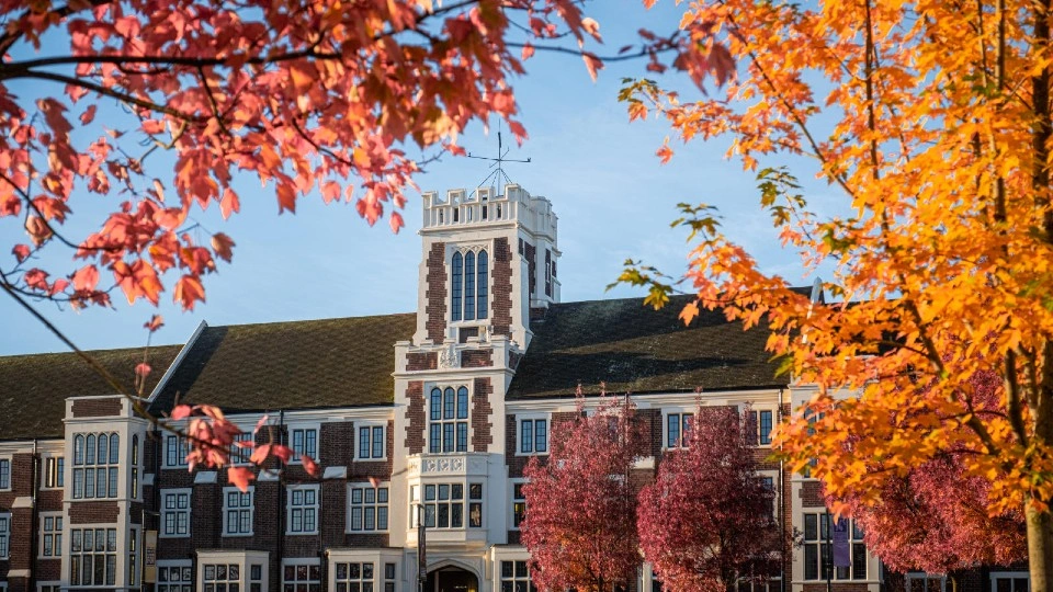 Hazlerigg Building with autumnal leaves.