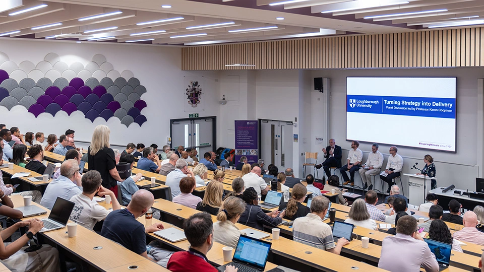 A group of staff in a lecture theatre