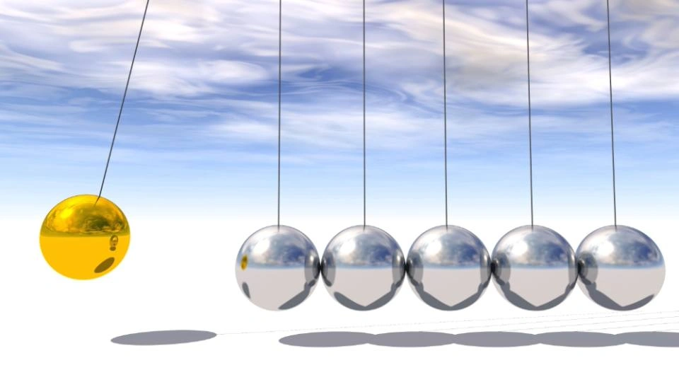 A Newton pendulum suspended in a cloudy sky