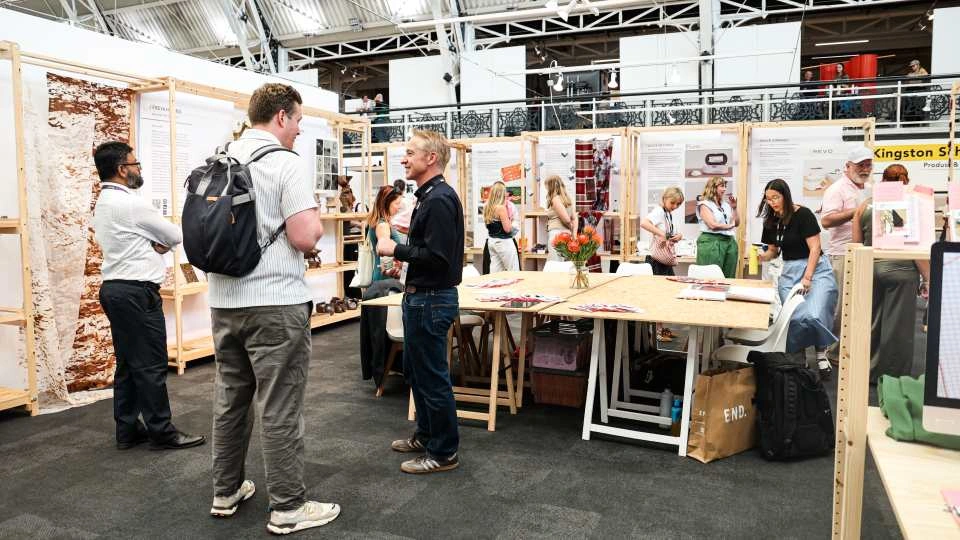 People networking at the New Designers exhibition in London.
