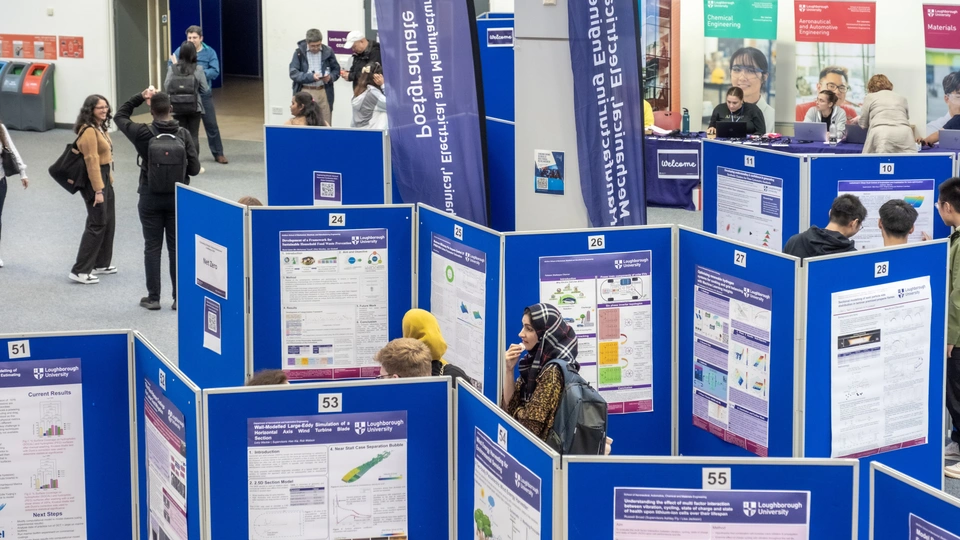 Students looking around poster display