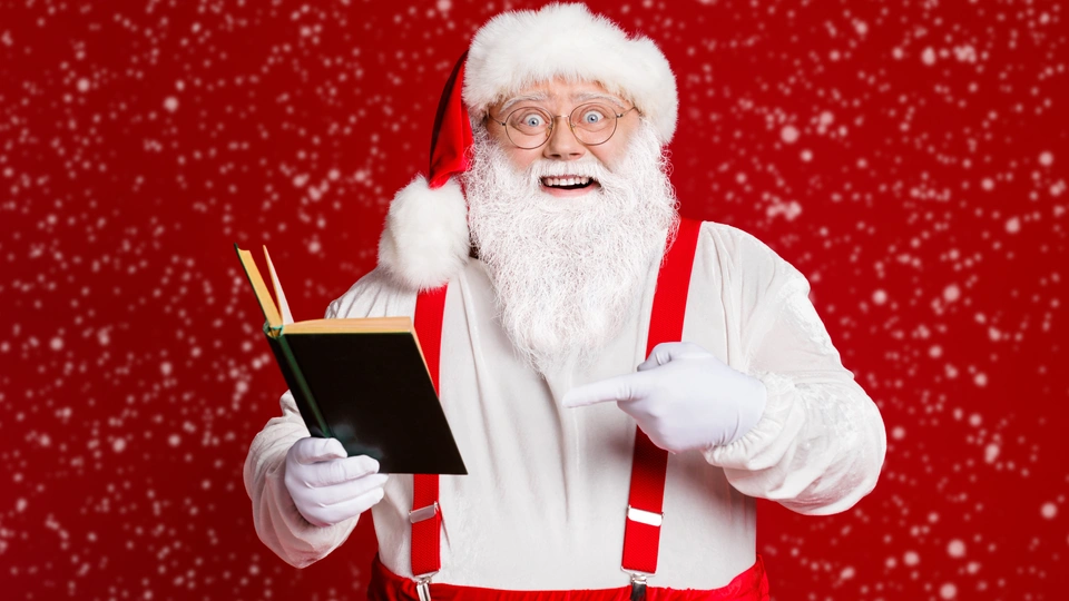Santa reads his joke book